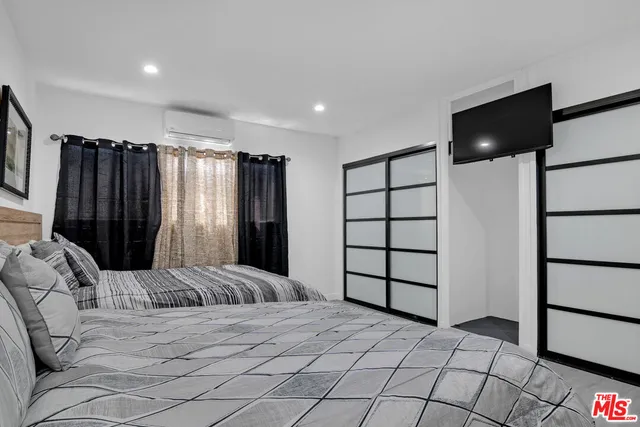 a view of a room with wooden floor and window