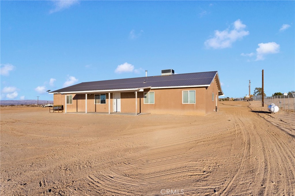32461 Prairie Avenue Barstow, CA 92311 - Photo 2 of 46 a front view of a house with a yard