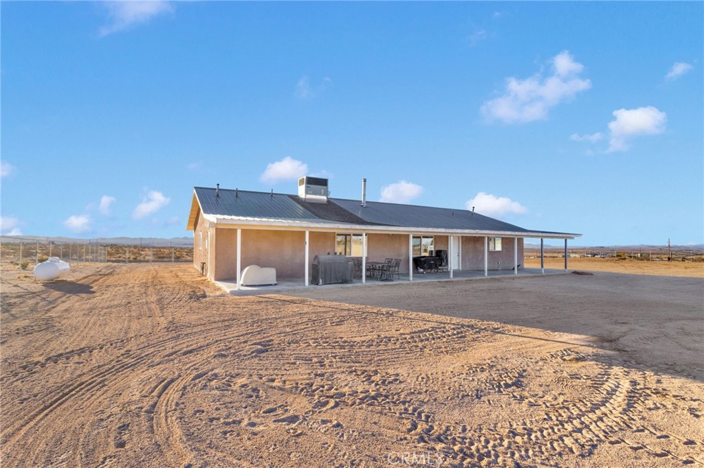 32461 Prairie Avenue Barstow, CA 92311 - Photo 29 of 46 a front view of a house with a yard