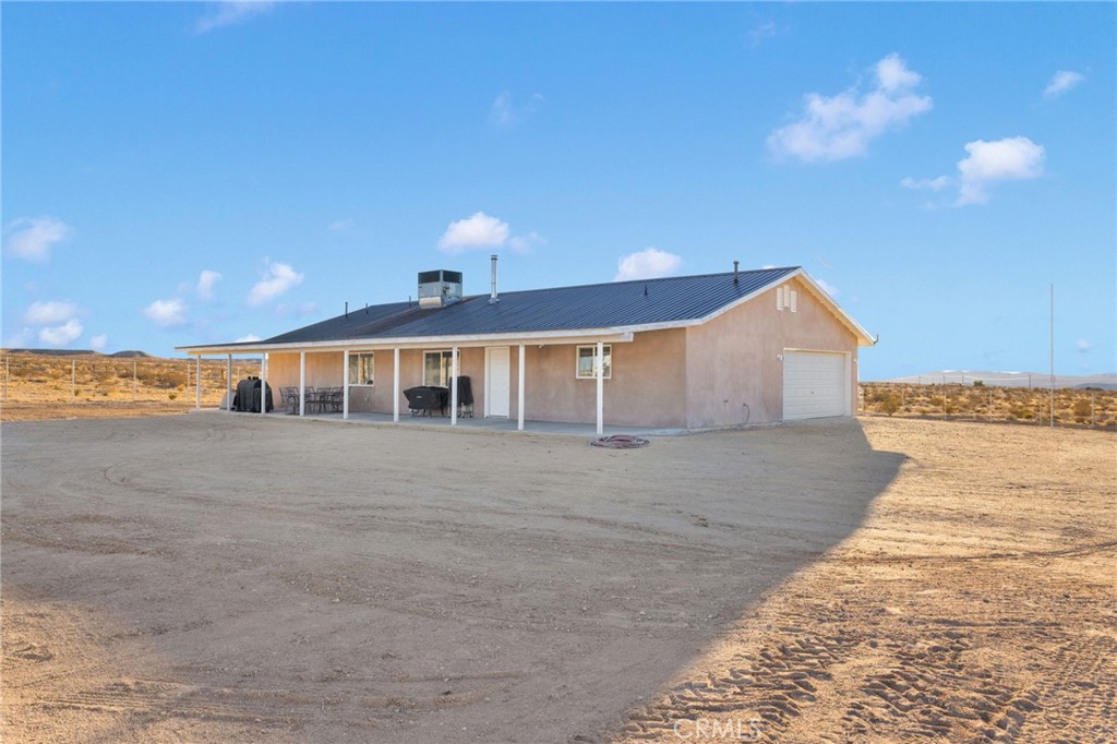 32461 Prairie Avenue Barstow, CA 92311 - Photo 31 of 46 a front view of a house with a yard