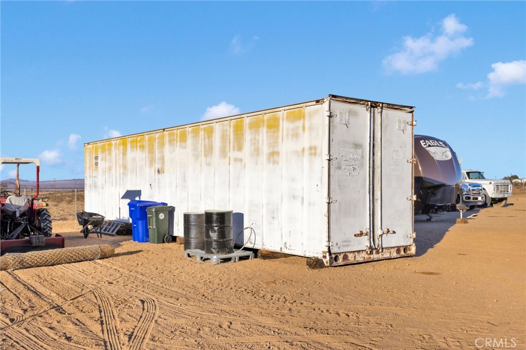 32461 Prairie Avenue Barstow, CA 92311 - Photo 32 of 46 a bed room with a bed and a television