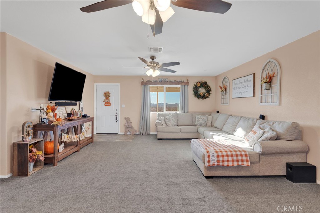 32461 Prairie Avenue Barstow, CA 92311 - Photo 5 of 46 a living room with furniture and a flat screen tv