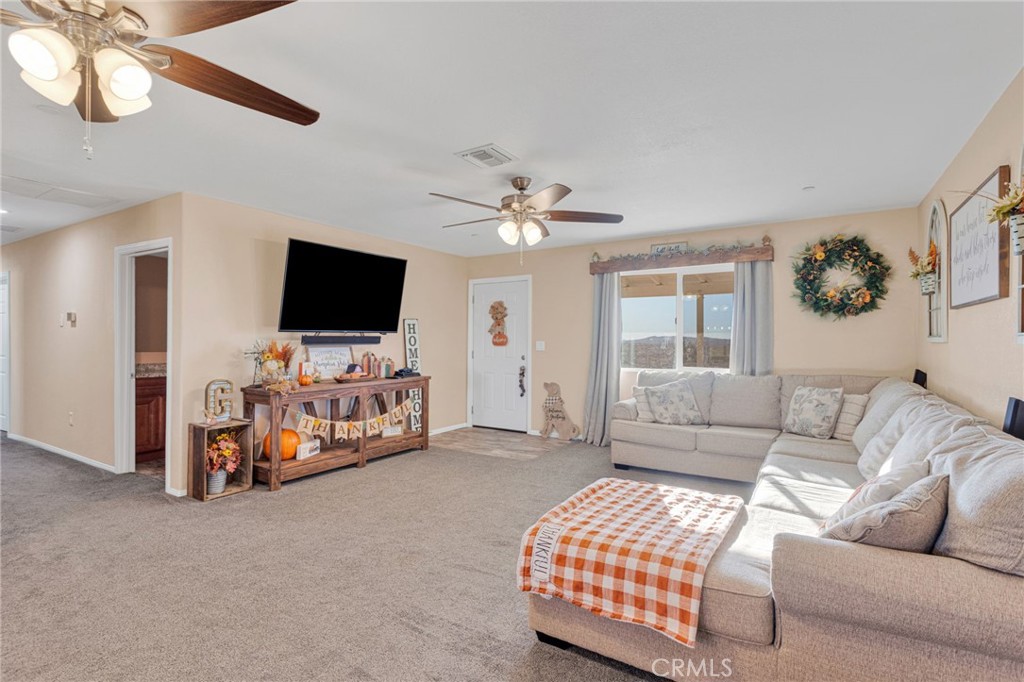 32461 Prairie Avenue Barstow, CA 92311 - Photo 6 of 46 a living room with furniture and a flat screen tv