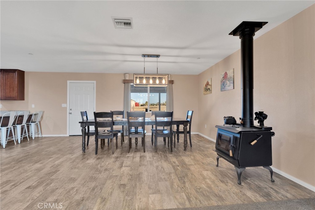 32461 Prairie Avenue Barstow, CA 92311 - Photo 8 of 46 a view of a dining room with furniture and chandelier