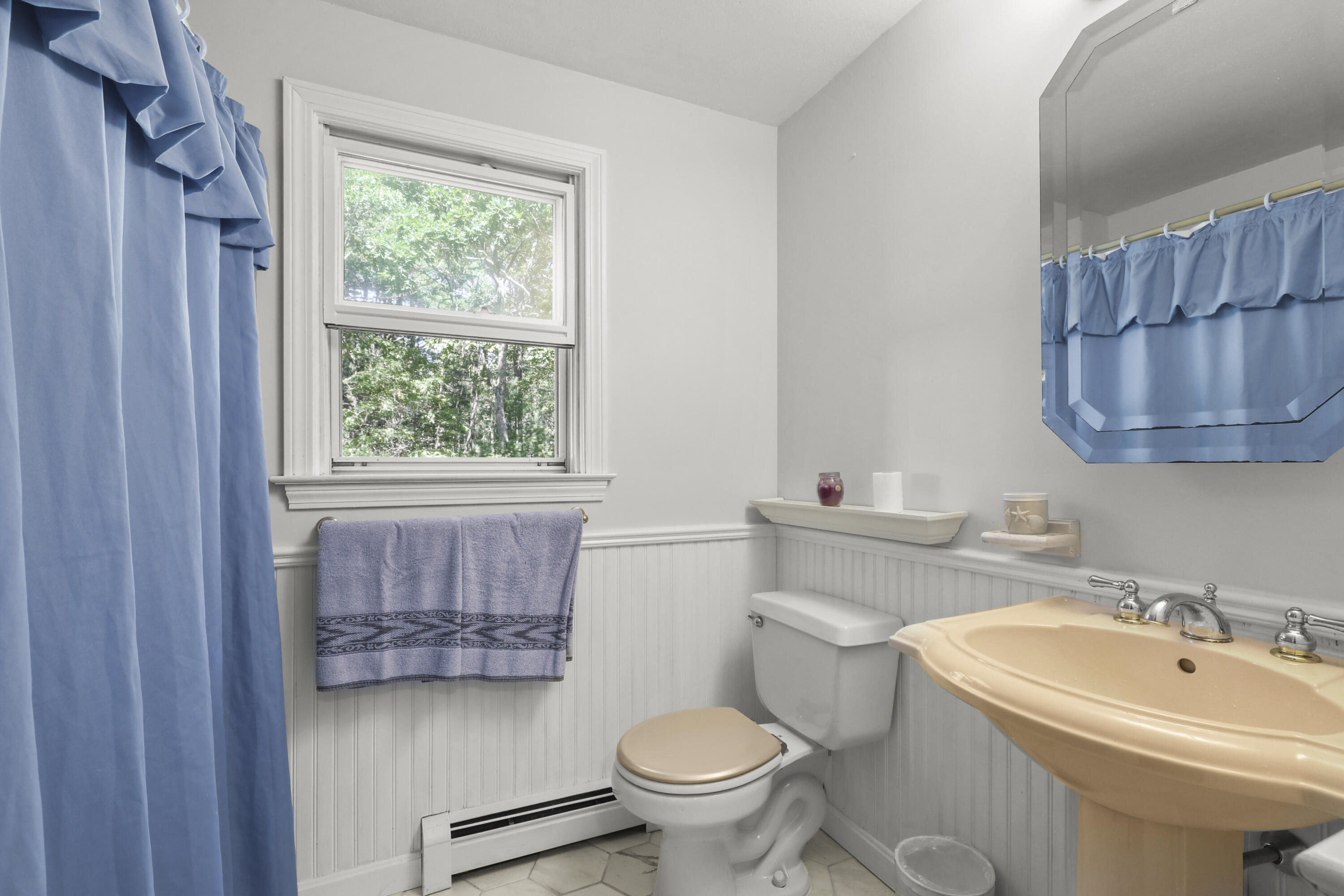 89 Degrass Road Mashpee, MA 02649 - Photo 15 of 37 a bathroom with a toilet sink and mirror