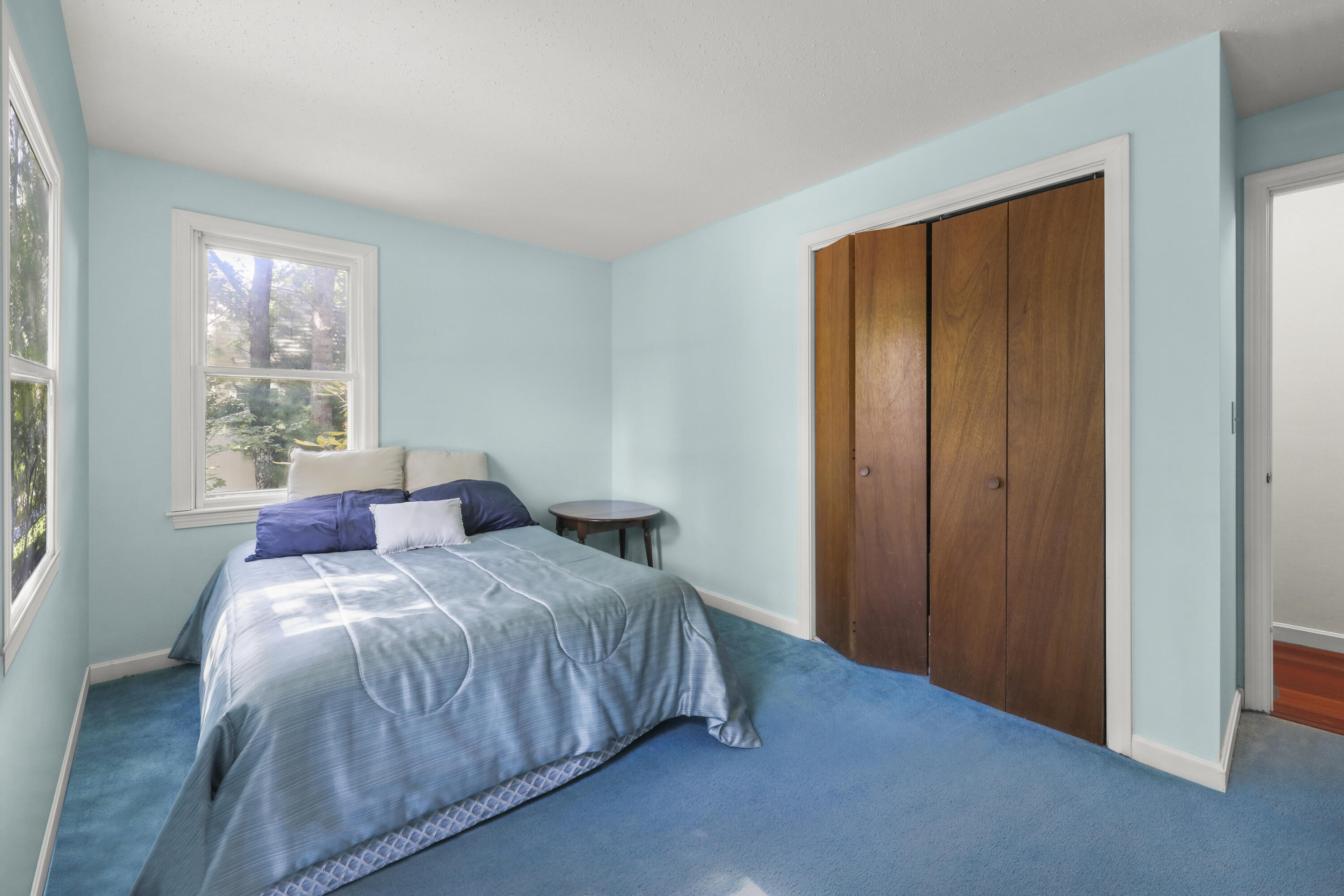 89 Degrass Road Mashpee, MA 02649 - Photo 19 of 37 a bedroom with a bed and large windows