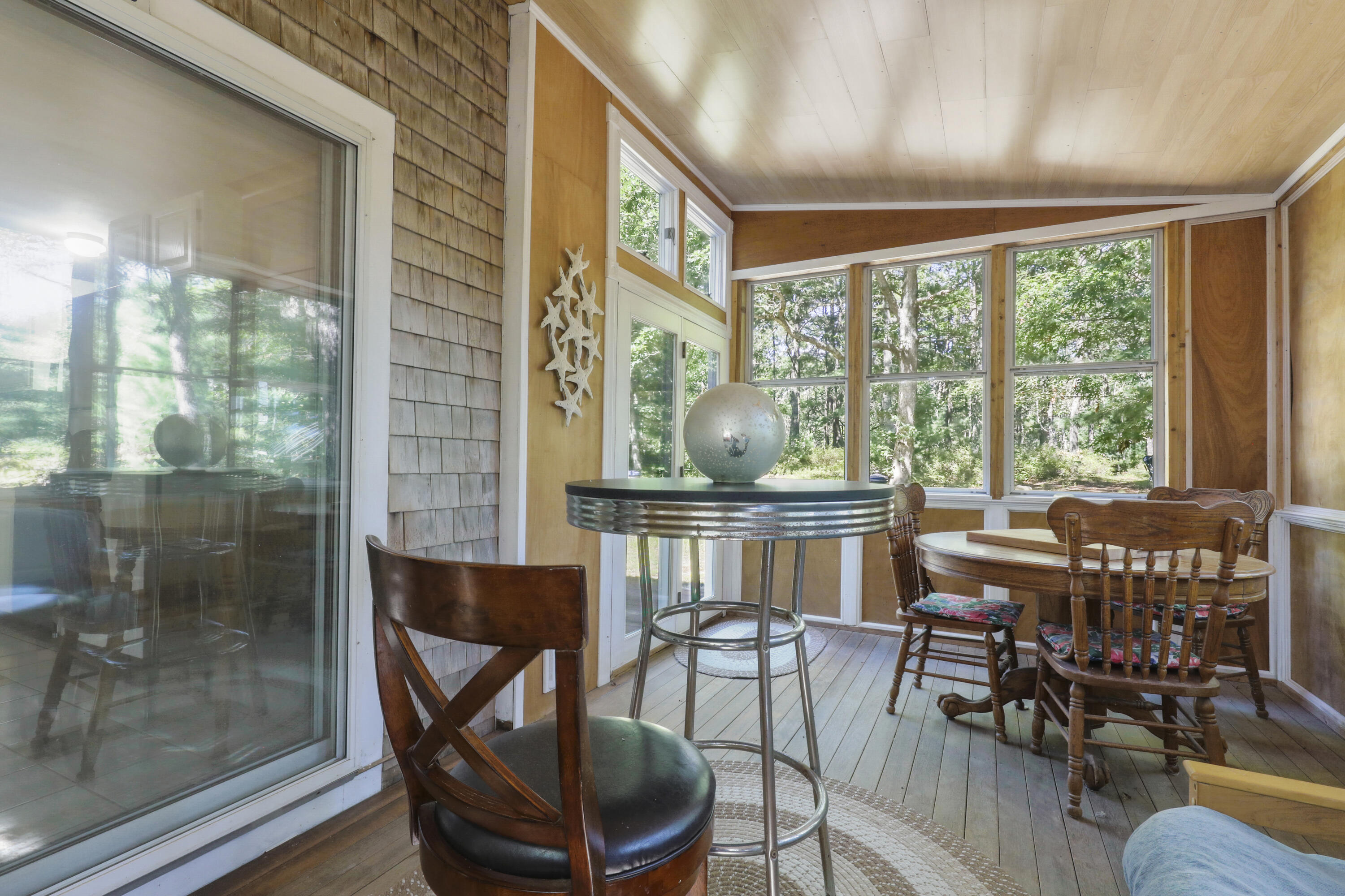 89 Degrass Road Mashpee, MA 02649 - Photo 33 of 37 a view of a dining room with furniture window and outside view
