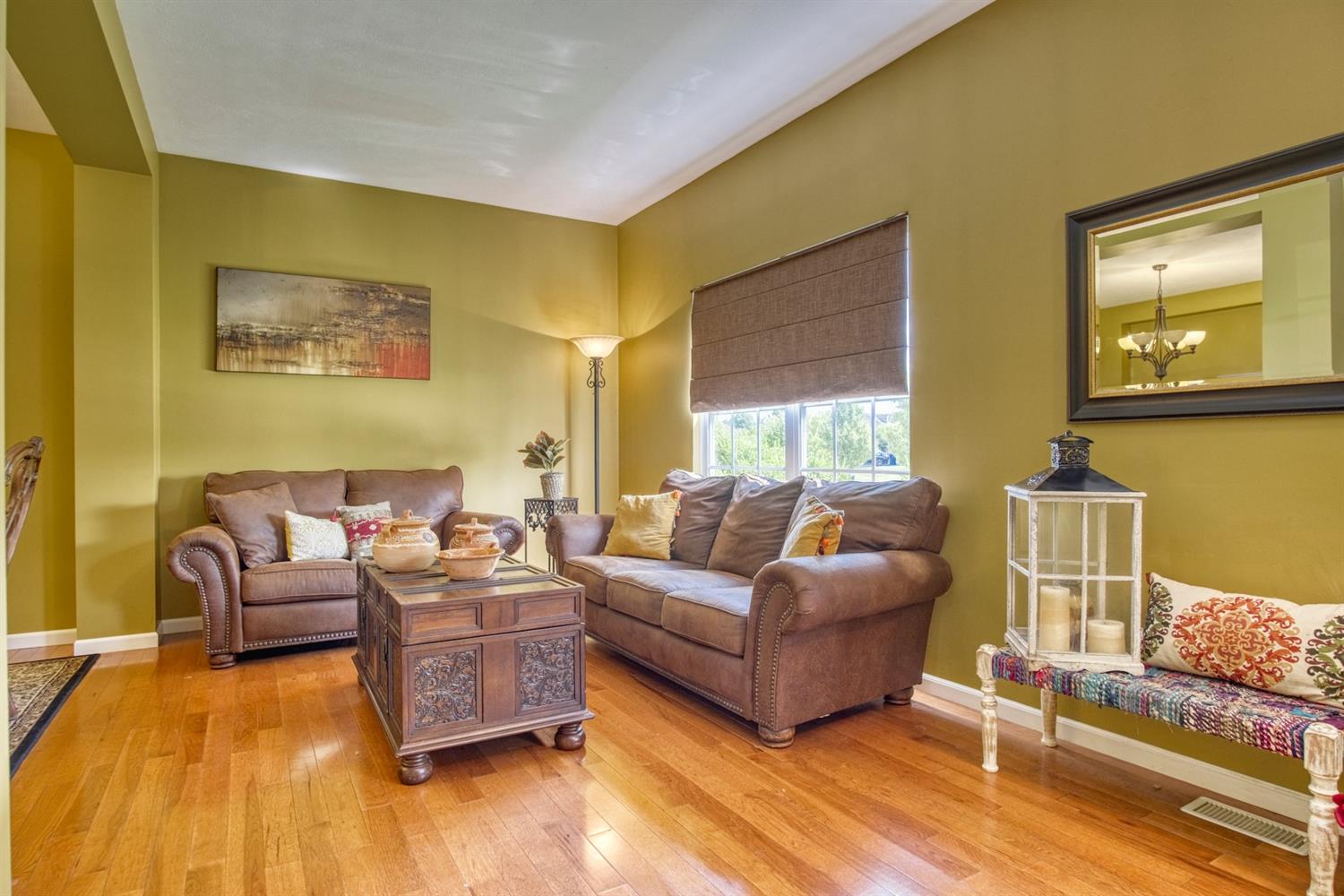 9512 Dewey Place Crown Point, IN 46307 - Photo 2 of 27 a living room with furniture and a large window