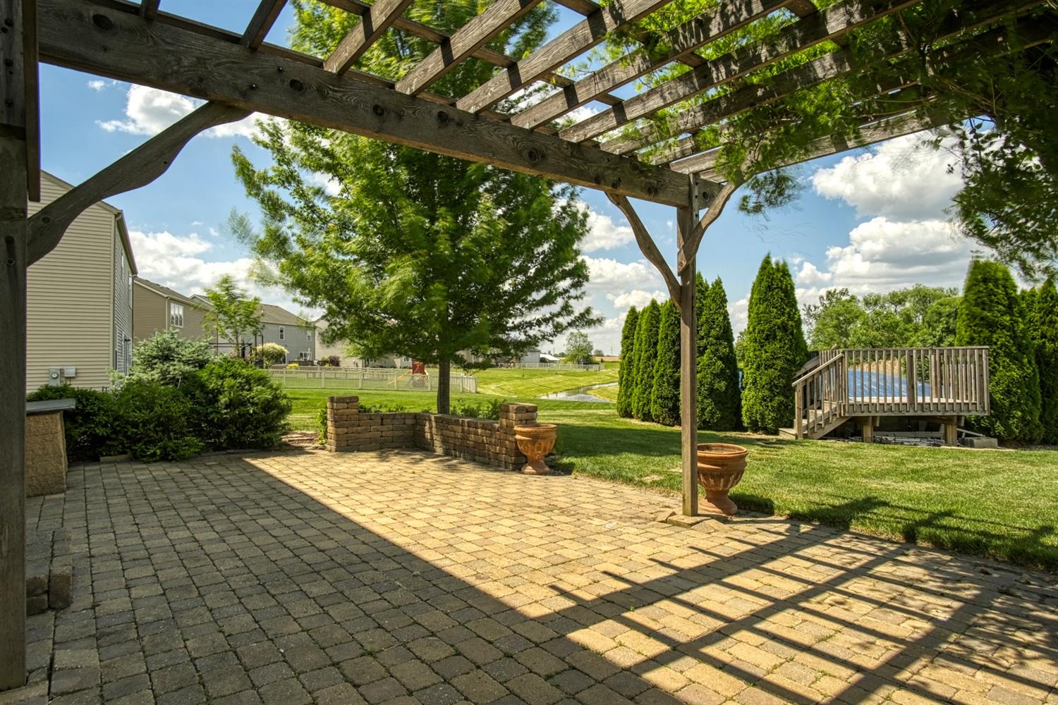 9512 Dewey Place Crown Point, IN 46307 - Photo 23 of 27 a view of a backyard with a garden