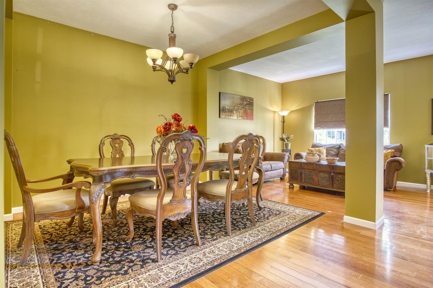 9512 Dewey Place Crown Point, IN 46307 - Photo 3 of 27 a dining room with furniture and a chandelier