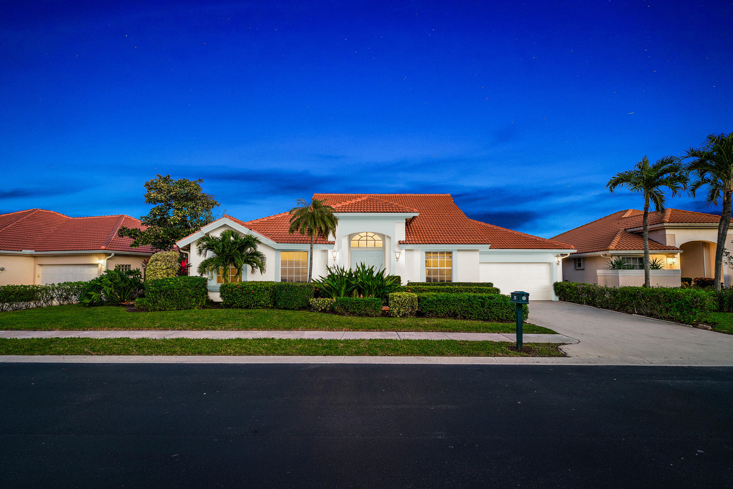 207 Eagleton Estates Boulevard Palm Beach Gardens, FL 33418 - Photo 1 of 33 a front view of a house with a yard