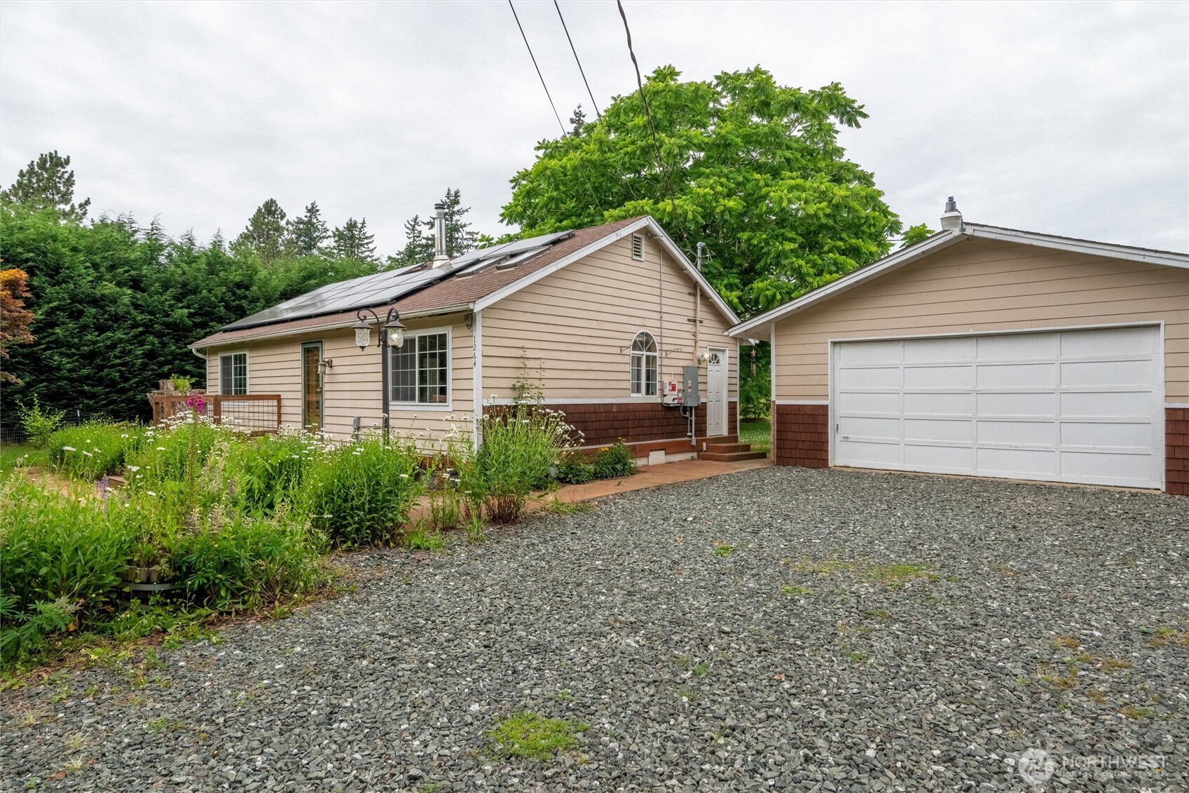1264 Birch Bay Lynden Road Lynden, WA 98264 - Photo 23 of 38 a view of a house with a yard and plants