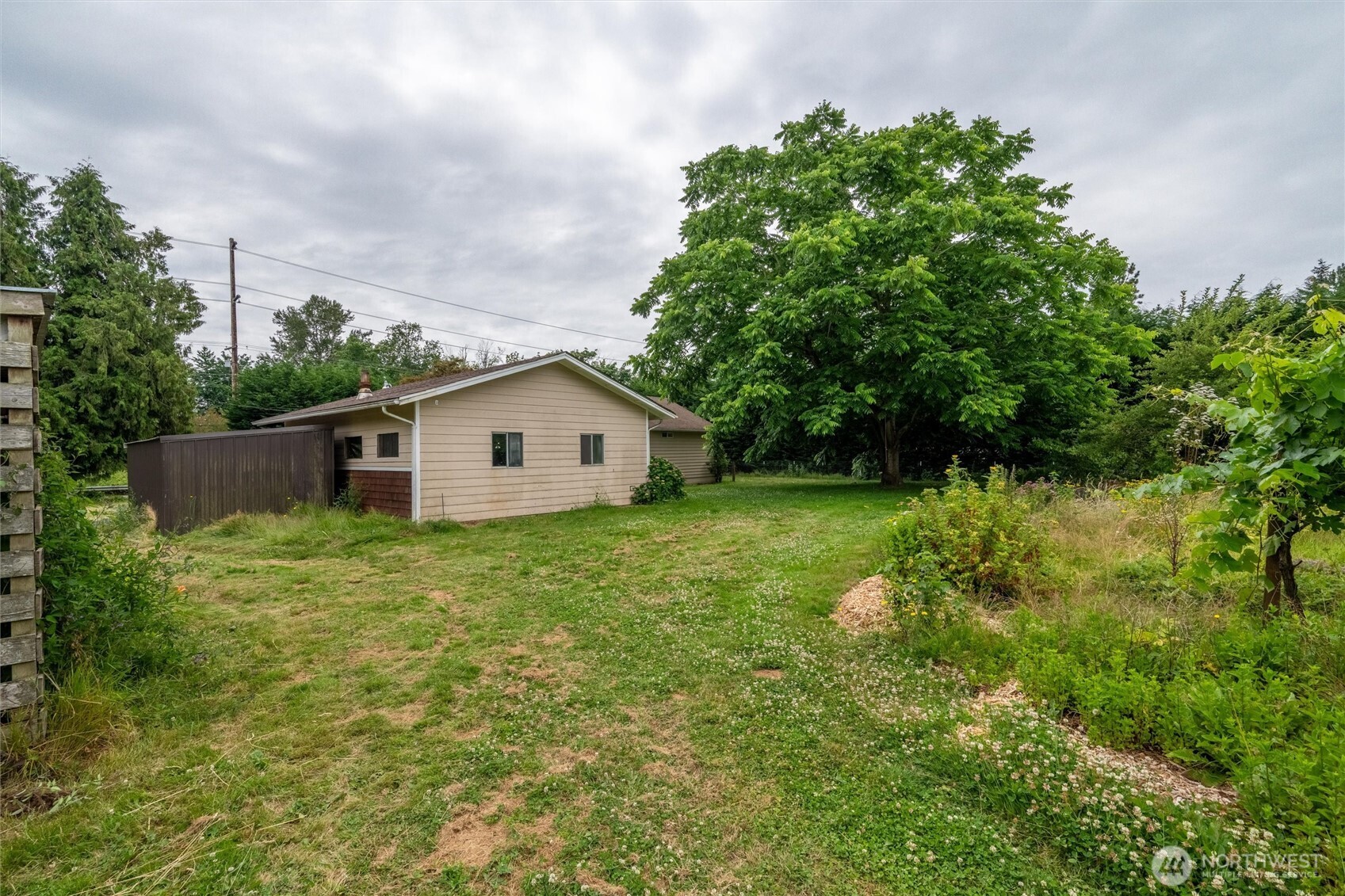 1264 Birch Bay Lynden Road Lynden, WA 98264 - Photo 29 of 38 a backyard of a house with lots of green space