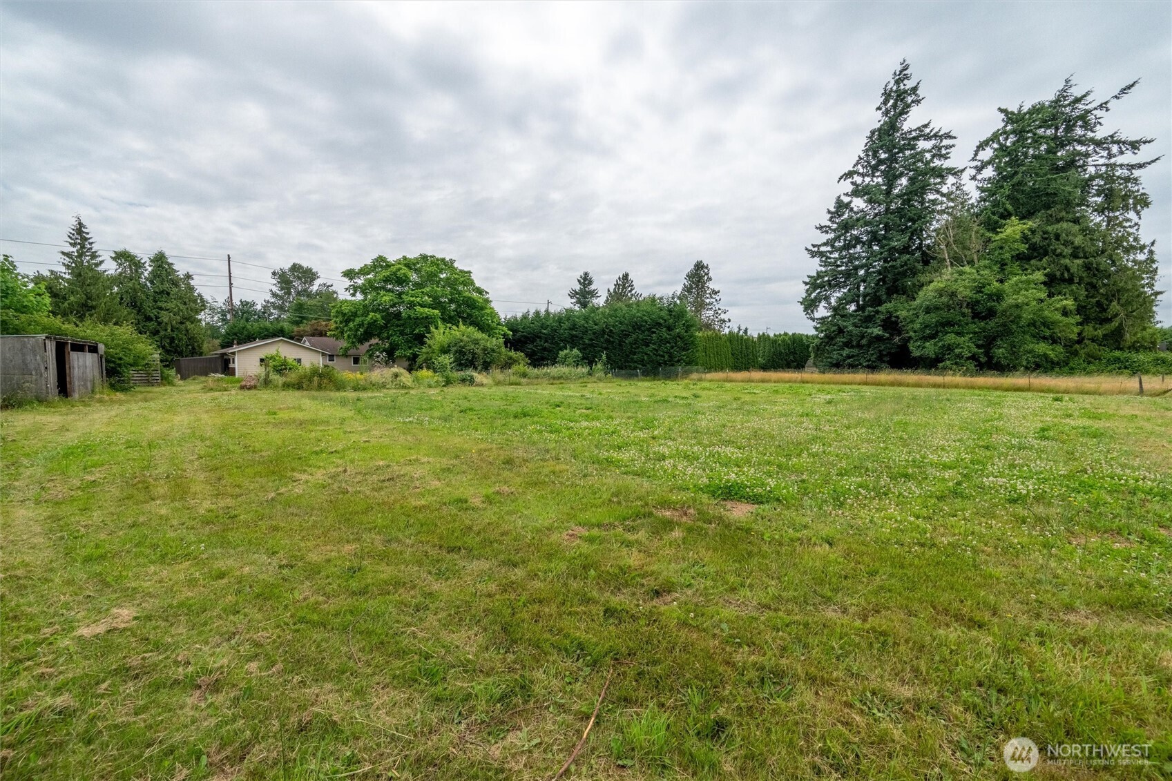 1264 Birch Bay Lynden Road Lynden, WA 98264 - Photo 33 of 38 a view of a field with trees in the background