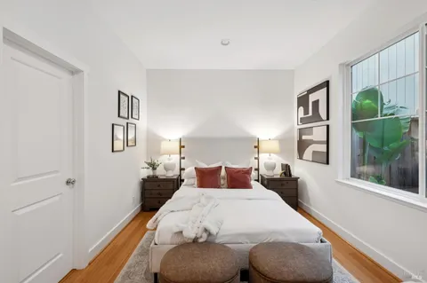 a bedroom with a bed and window