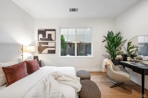 a bedroom with a bed and a view living room