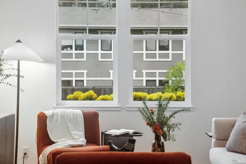 a living room with furniture and garden view