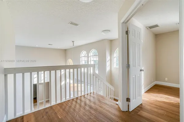 a view of entryway with wooden floor