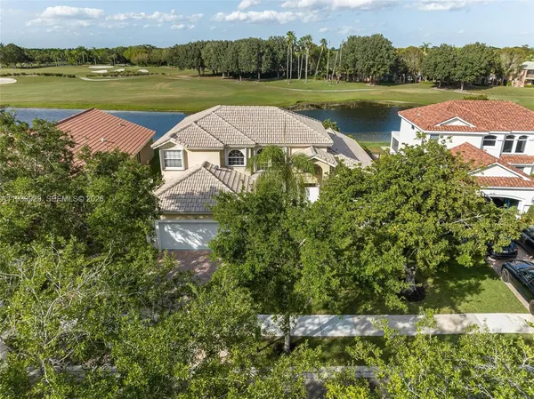 an aerial view of a house with lake view