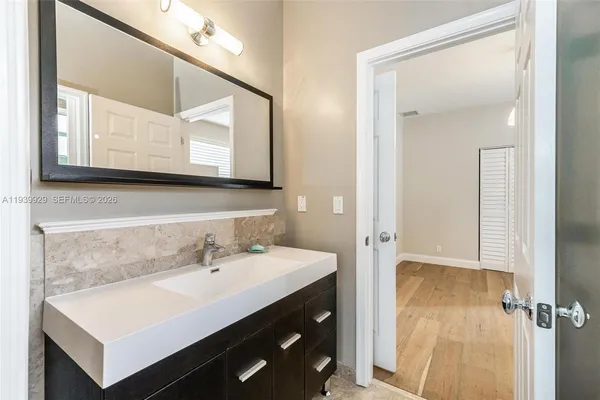 a open kitchen with granite countertop a sink stove and refrigerator