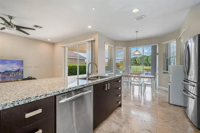 a view of a house with a yard and tree s