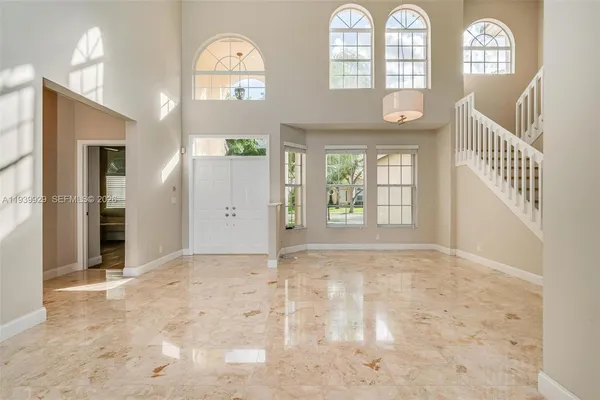 a view of an entryway with wooden floor