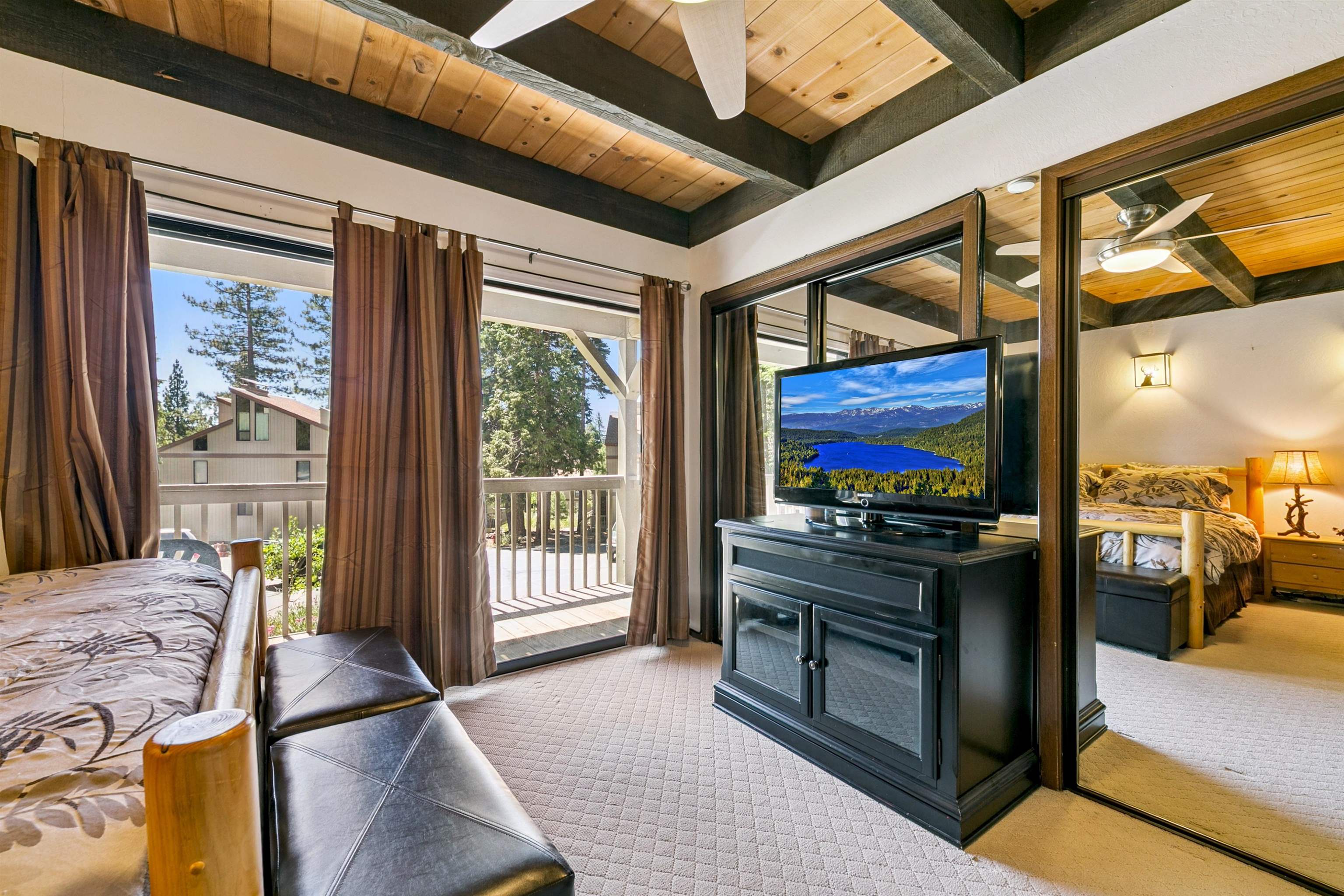 1001 Commonwealth Drive, Unit 106 Kings Beach, CA 96143 - Photo 13 of 27 a kitchen with stainless steel appliances granite countertop a stove and a view of living room