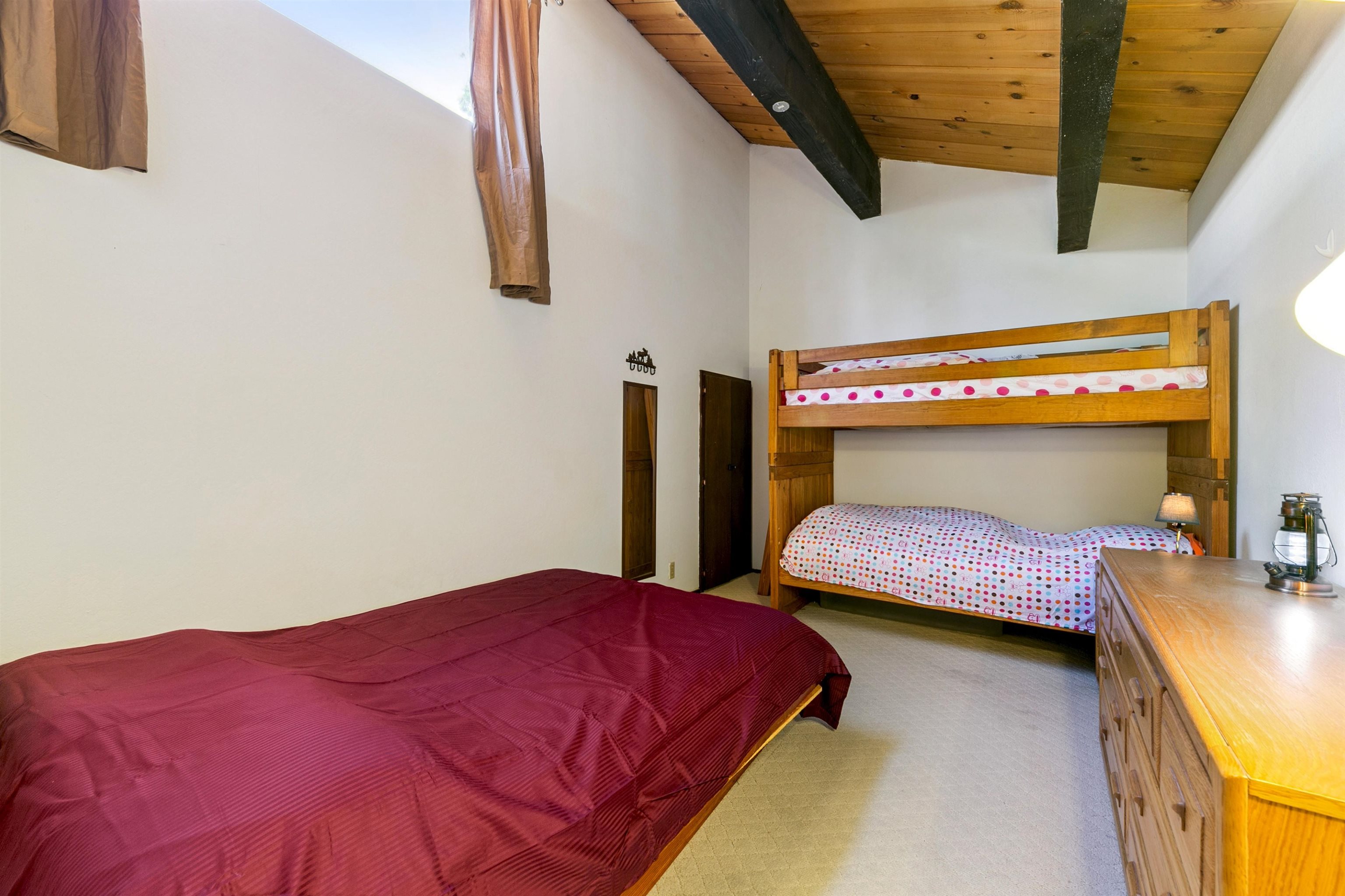 1001 Commonwealth Drive, Unit 106 Kings Beach, CA 96143 - Photo 19 of 27 a bedroom with a bed and a desk