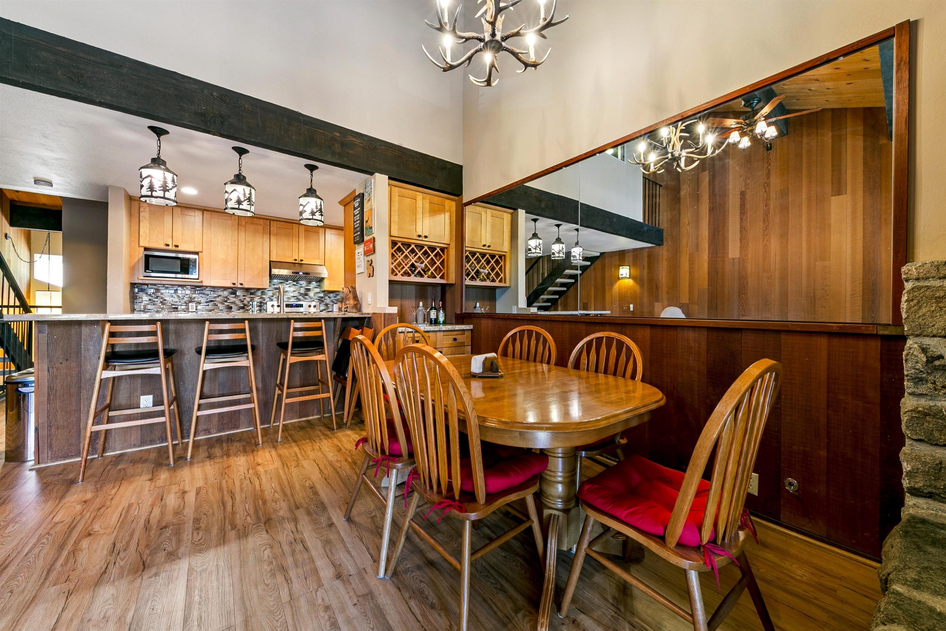 1001 Commonwealth Drive, Unit 106 Kings Beach, CA 96143 - Photo 6 of 27 a dinning table and chairs in a room