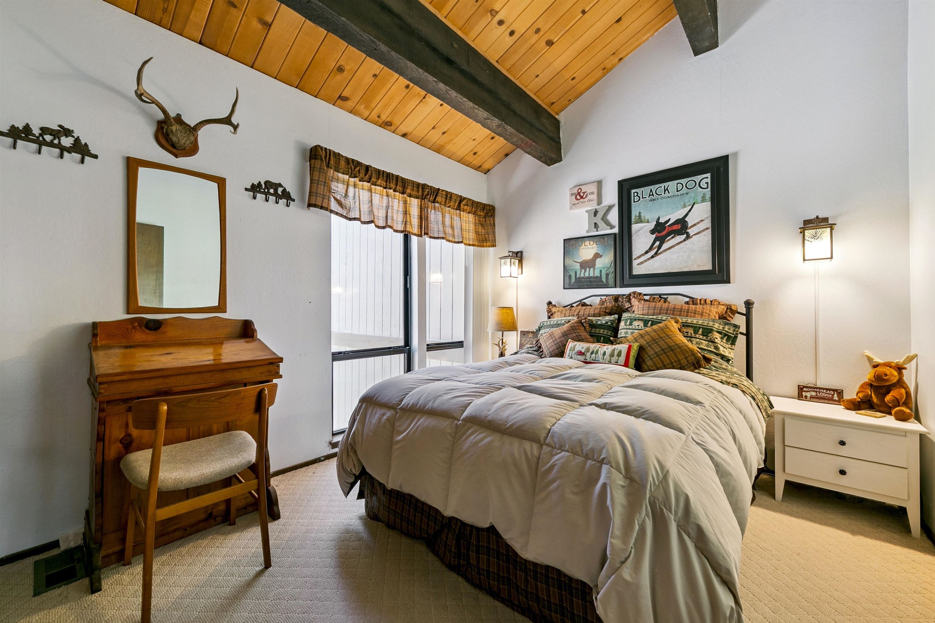 1001 Commonwealth Drive, Unit 106 Kings Beach, CA 96143 - Photo 10 of 27 a bedroom with a bed and a chair