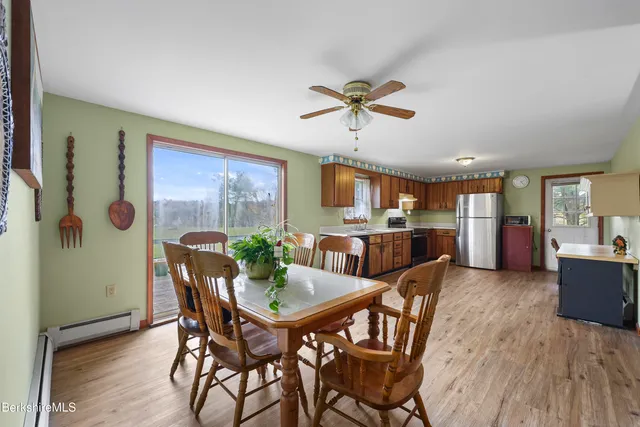 a view of a dining room with furniture and a livingroom