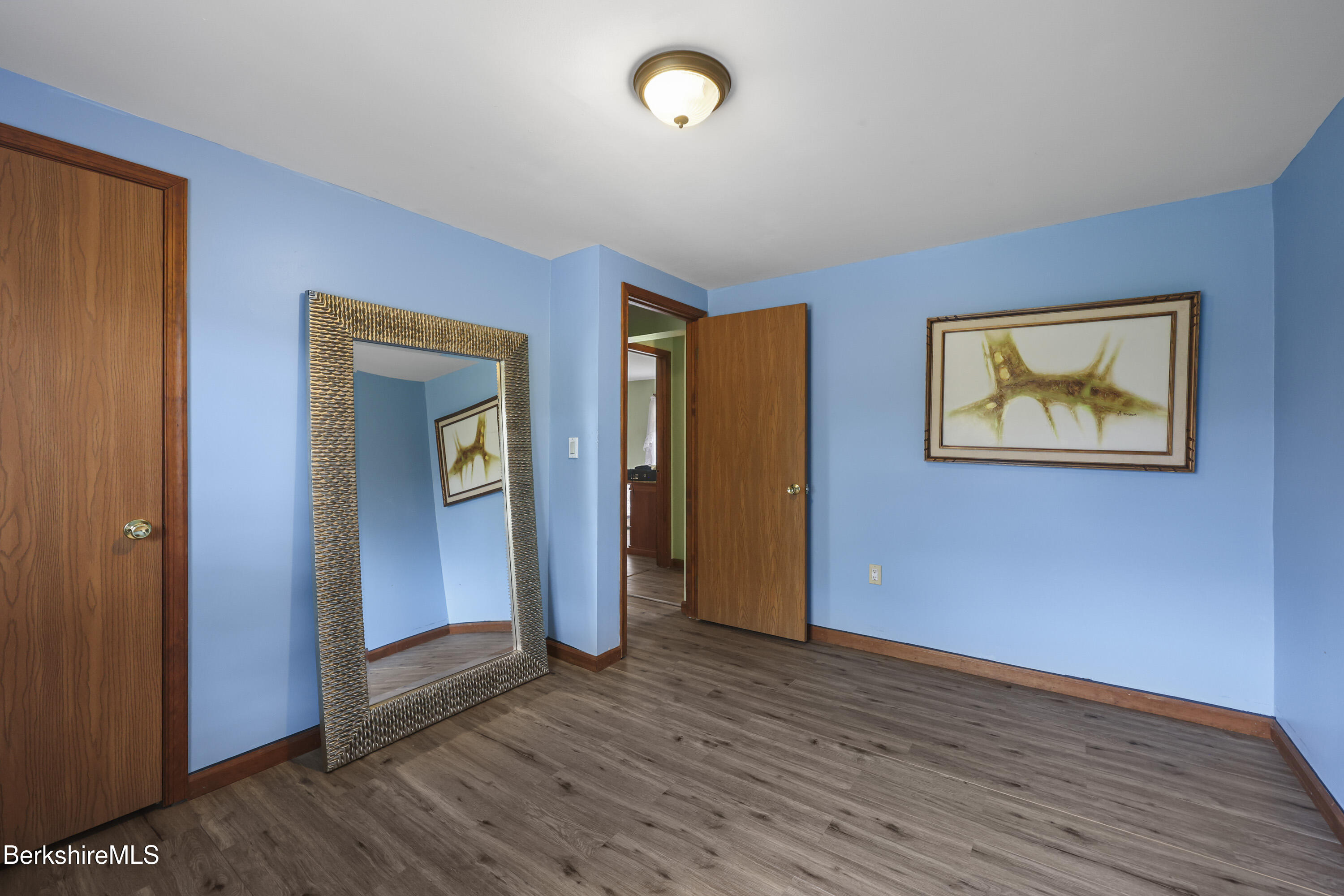 8 Samson Avenue Pittsfield, MA 01201 - Photo 19 of 55 a view of an empty room with wooden floor and closet