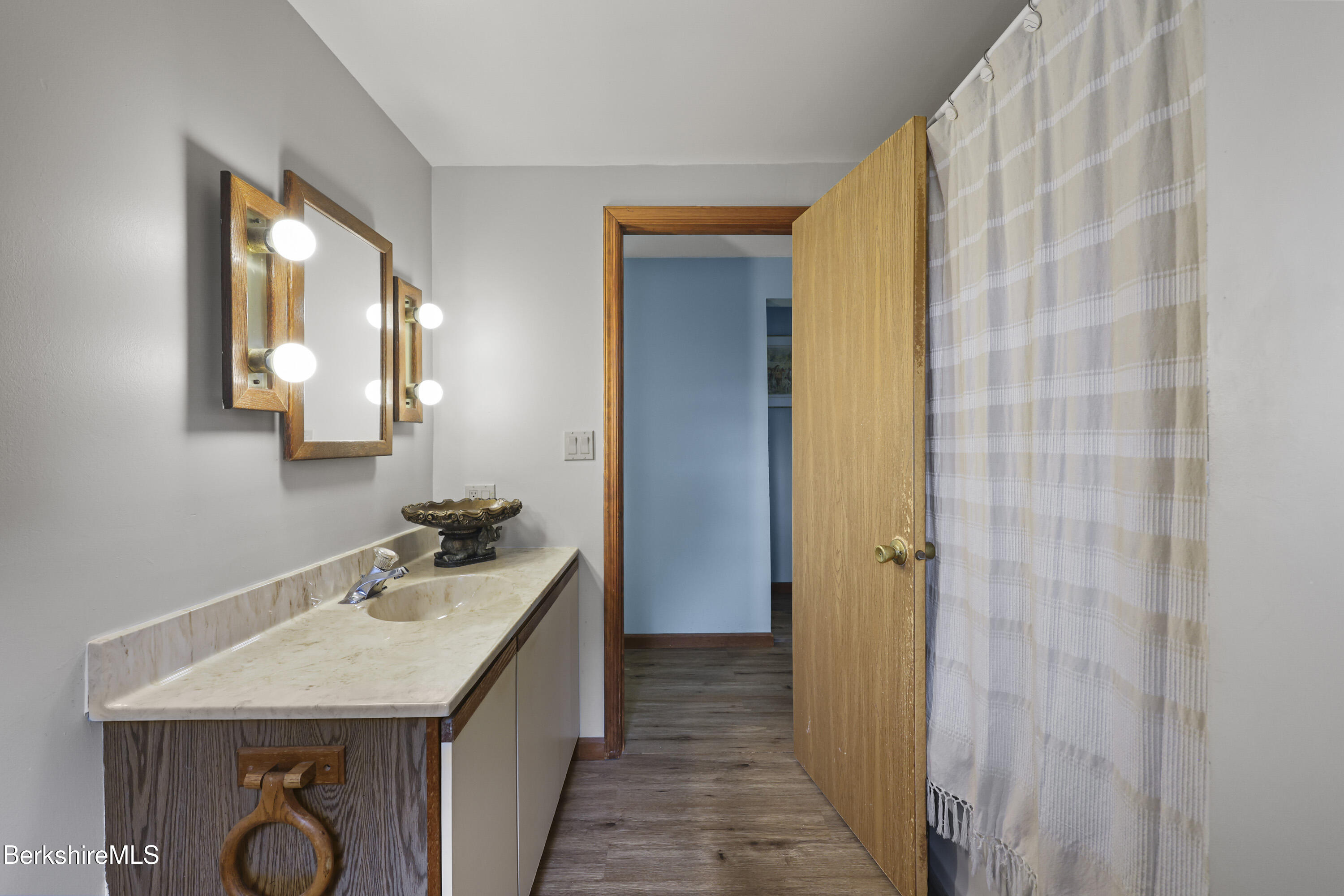 8 Samson Avenue Pittsfield, MA 01201 - Photo 21 of 55 a bathroom with a sink a mirror and a shower