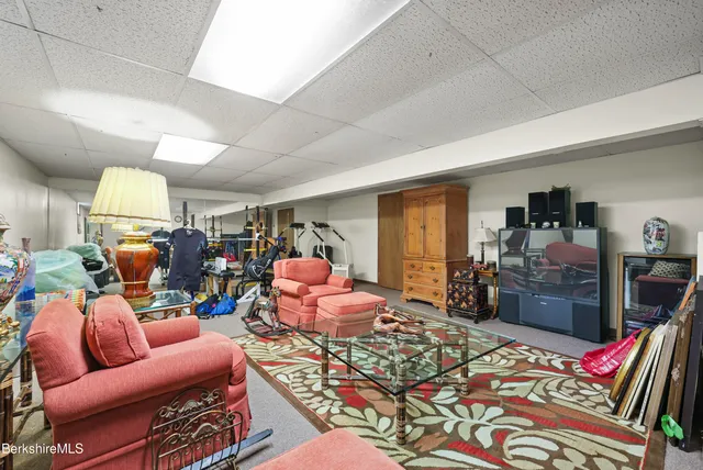 a bed room with furniture and a flat screen tv