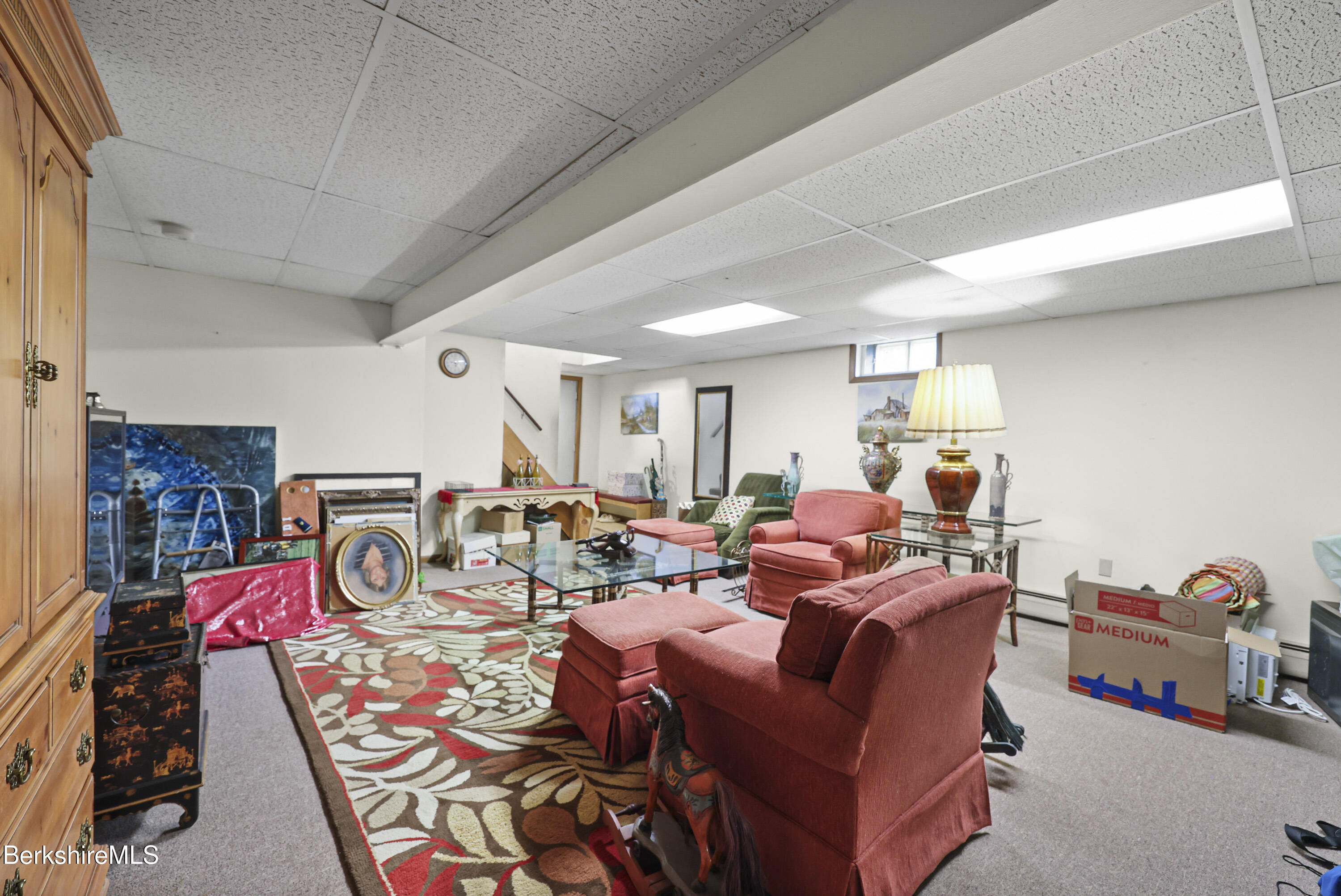 8 Samson Avenue Pittsfield, MA 01201 - Photo 23 of 55 a living room with furniture a flat screen tv and a table