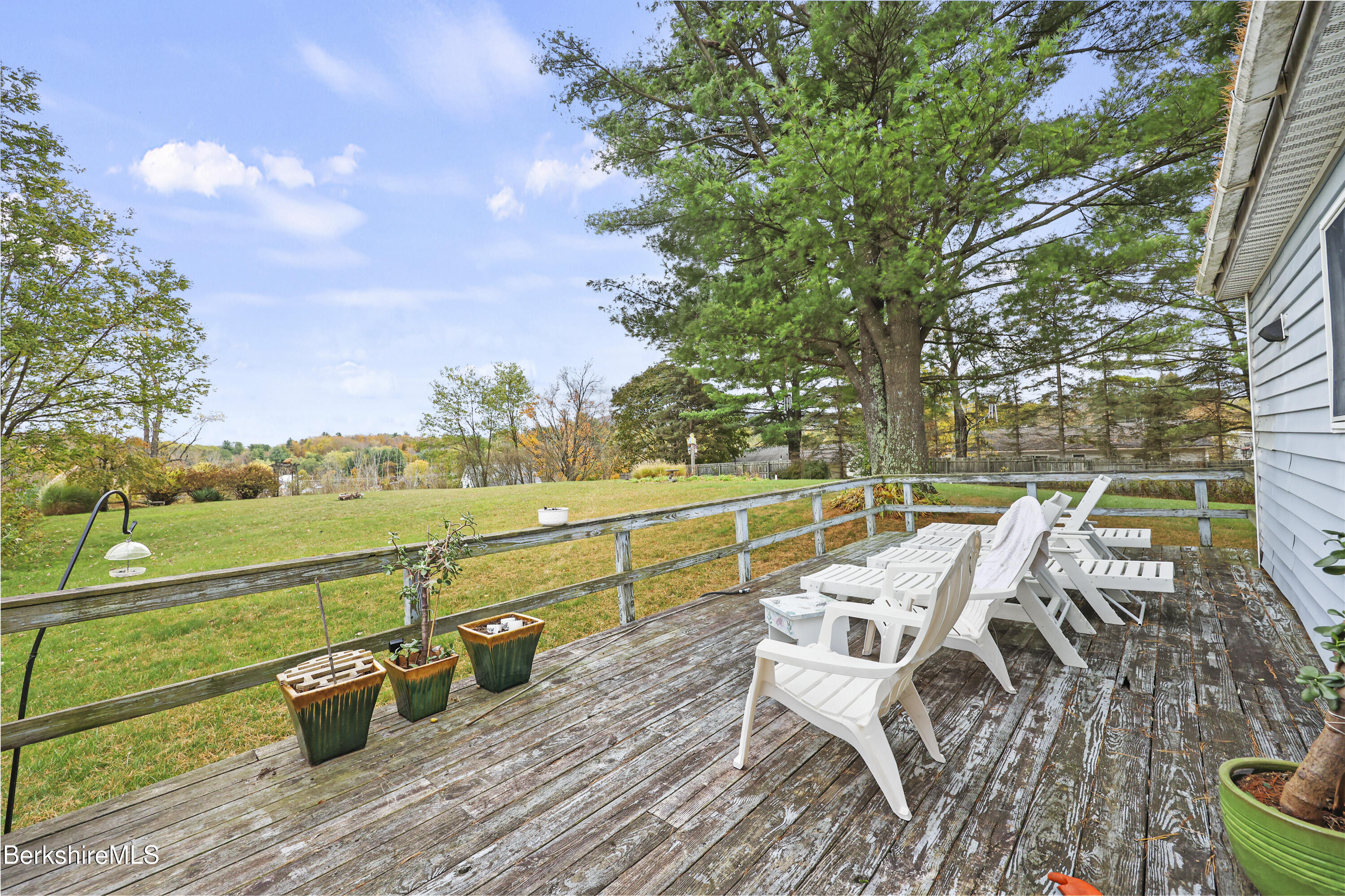 8 Samson Avenue Pittsfield, MA 01201 - Photo 26 of 55 a view of a lake with couches and wooden floor