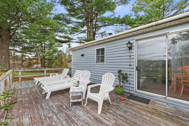 a view of outdoor sitting area with furniture and wooden deck