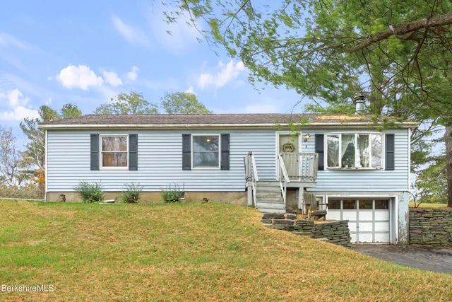 a front view of a house with a swimming pool