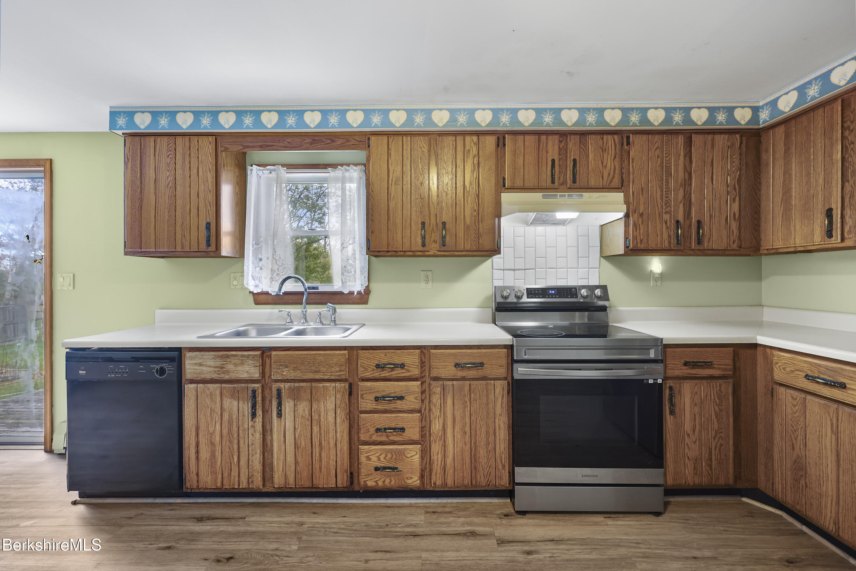 8 Samson Avenue Pittsfield, MA 01201 - Photo 4 of 55 a kitchen with a sink and cabinets