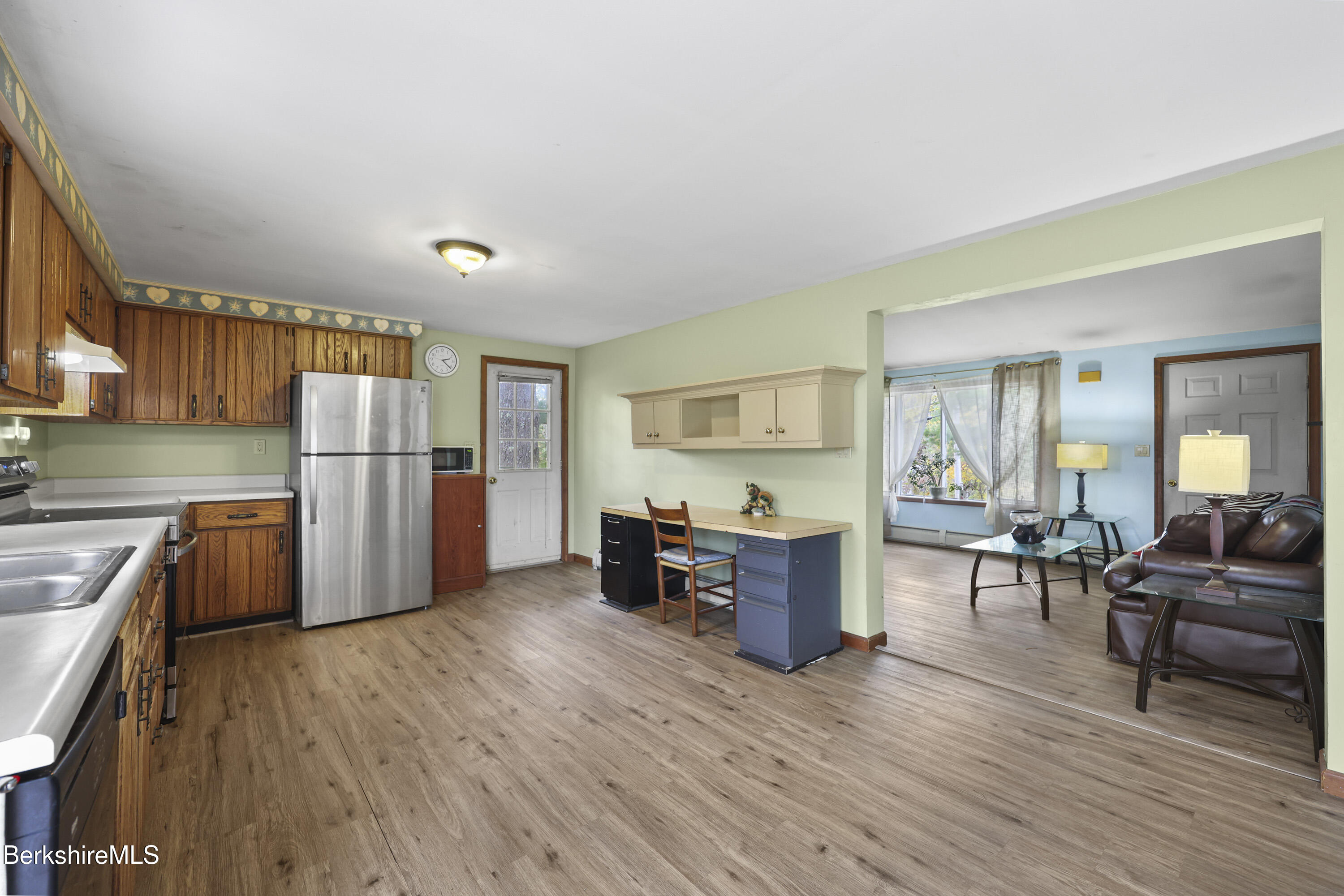 8 Samson Avenue Pittsfield, MA 01201 - Photo 5 of 55 a kitchen with stainless steel appliances a refrigerator and wooden floor