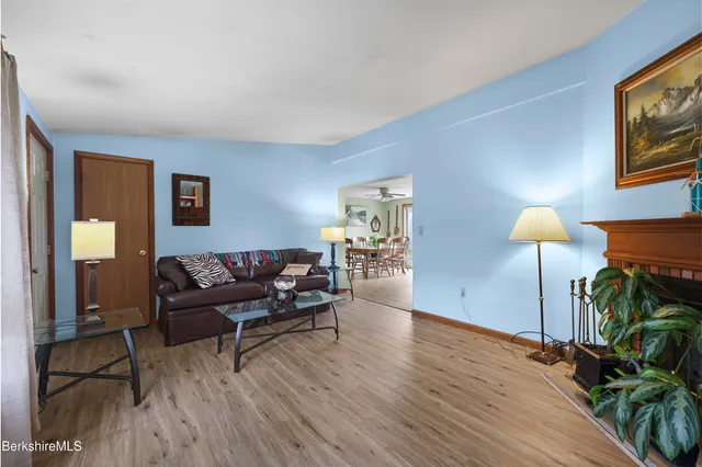 a living room with furniture and a lamp