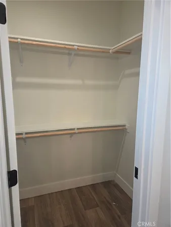a view of an empty walk in closet