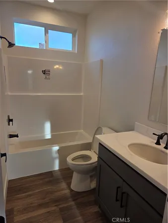 a bathroom with a sink a toilet and a bathtub