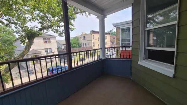 a view of a porch with a large window