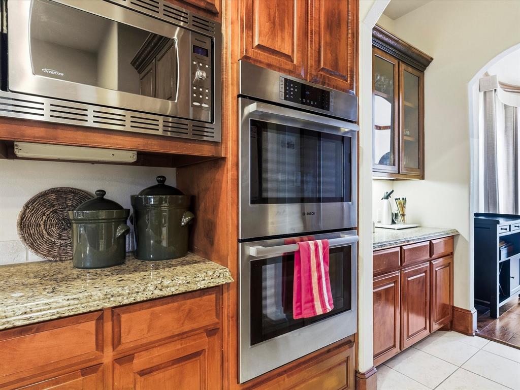 1615 Roma Lane Allen, TX 75013 - Photo 10 of 36 Stainless steel double wall ovens integrated into custom wood cabinetry