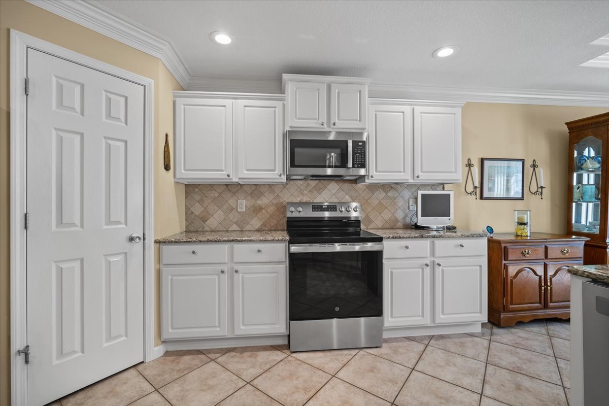 1721 Partridge Point Normal, IL 61761 - Photo 12 of 37 a kitchen with cabinets appliances and a window