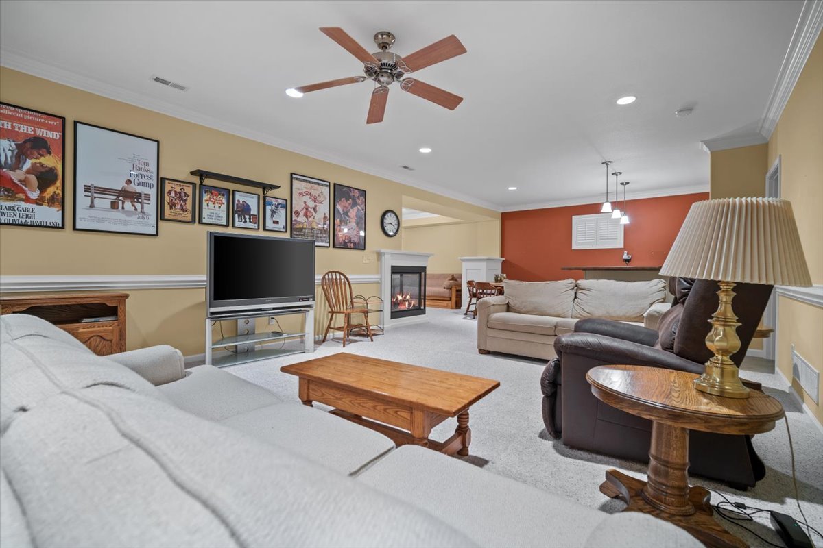 1721 Partridge Point Normal, IL 61761 - Photo 16 of 37 a living room with furniture a flat screen tv and a table
