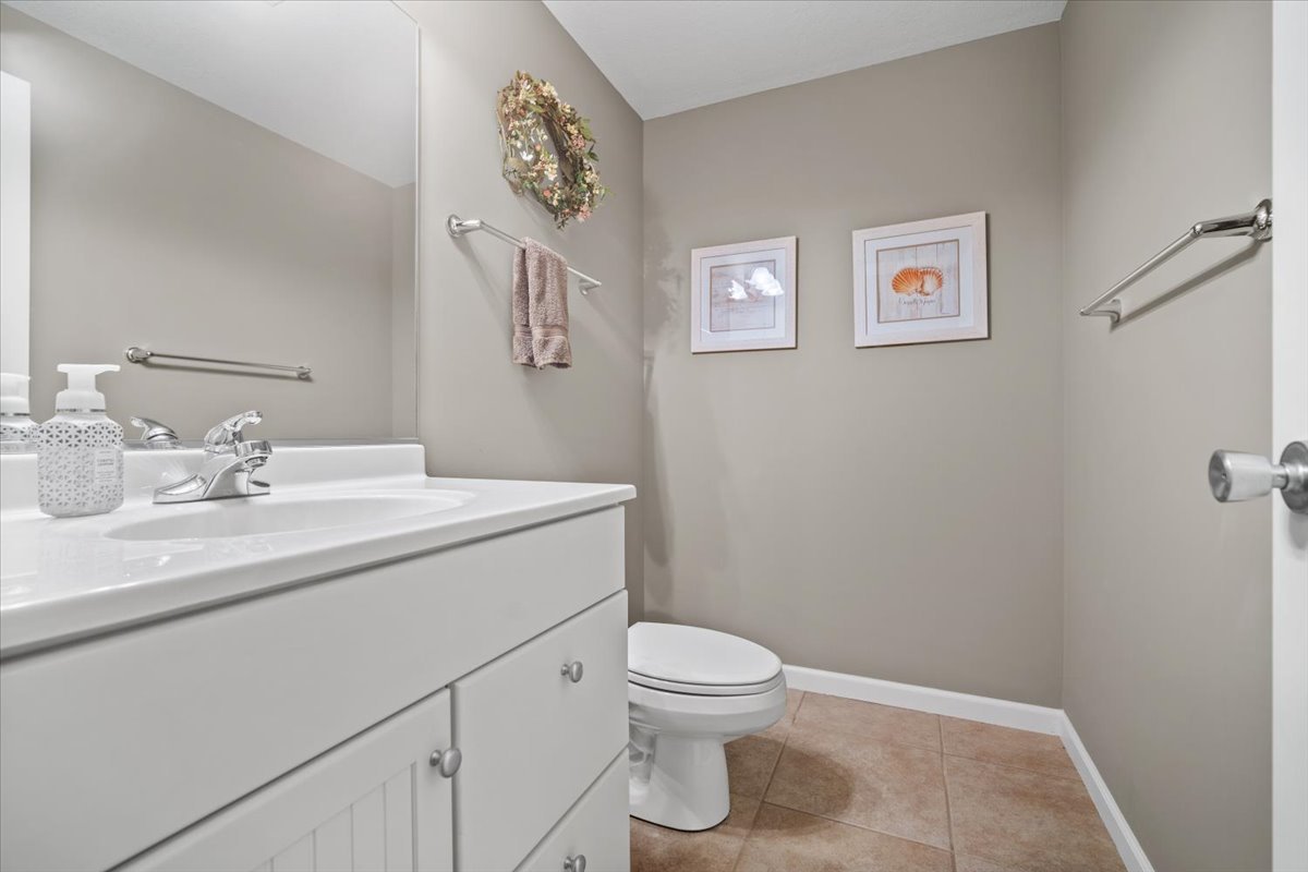 1721 Partridge Point Normal, IL 61761 - Photo 20 of 37 a bathroom with a toilet sink vanity and mirror