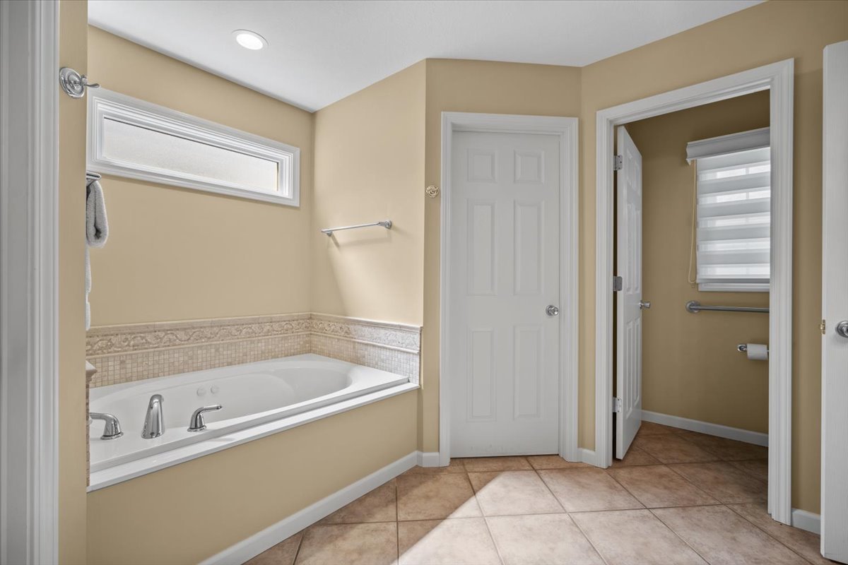 1721 Partridge Point Normal, IL 61761 - Photo 27 of 37 a bathroom with a bathtub and a shower