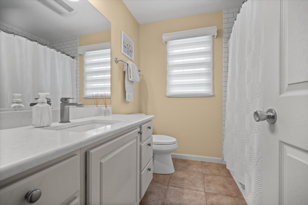 1721 Partridge Point Normal, IL 61761 - Photo 29 of 37 a bathroom with a sink a toilet and a window